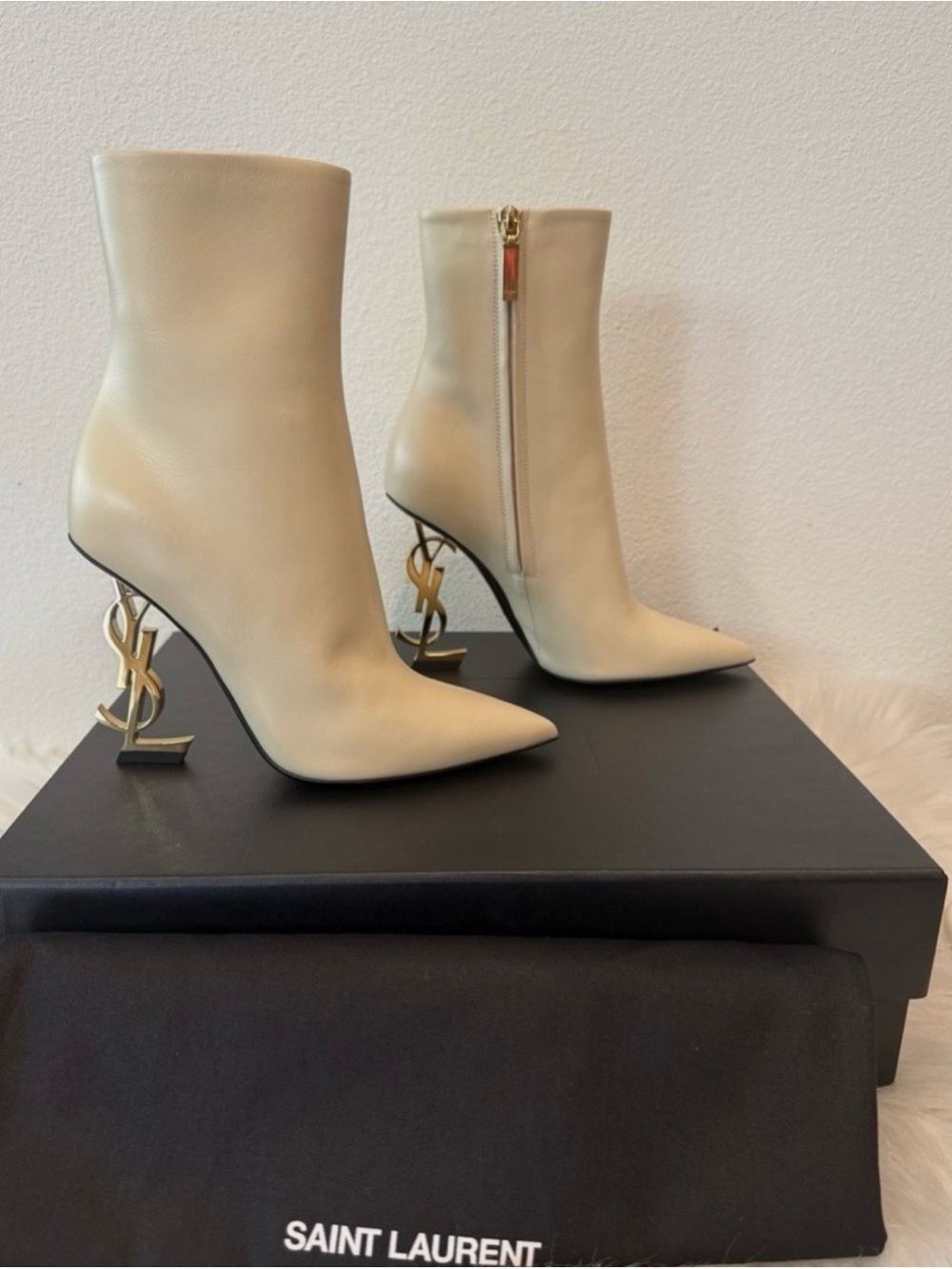 Saint Laurent Beige Opyum Booties with YSL emblem.